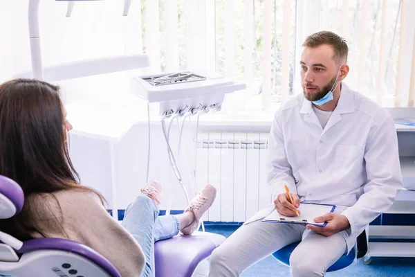 Dentist Workplace Writes Patient Answers History Taking Female Patient Sitting — Stock Photo, Image