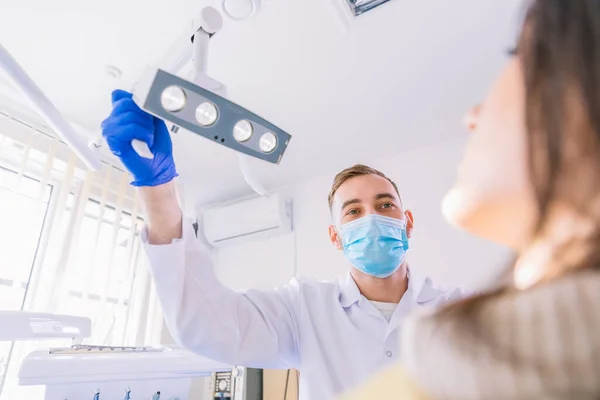 Professional Dentist Working Clinic Adjusting Dental Lamp Examining Teeth Female — Stock Photo, Image