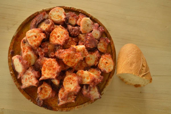 Ration From Octopus To Feira With Spicy Paprika With A Piece Of Bread To The Side At The Becerrea Octopus Fair. Cooking, Food, Travel, Vacation. August 3, 2018. Becerrea, Lugo, Galicia, Spain.