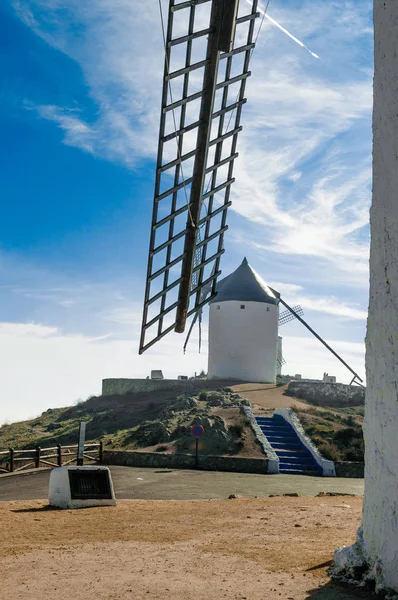 Windmill On Top Of Cerro Calderico Seen Through A Blade In Consuegra. December 26, 2018. Consuegra Toledo Castilla La Mancha Spain Europe. Travel Tourism Street Photography.