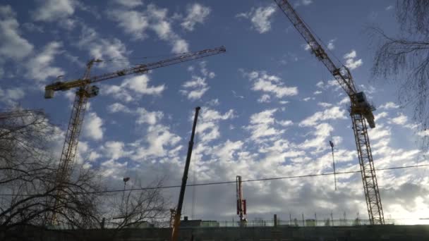 Construction Site Two Tower Cranes Background Sunny Sky Clouds One — Stock Video