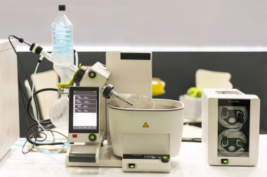 Close up high technology rotary vacuum evaporator with distillation flask in chemical laboratory for scientific clipart