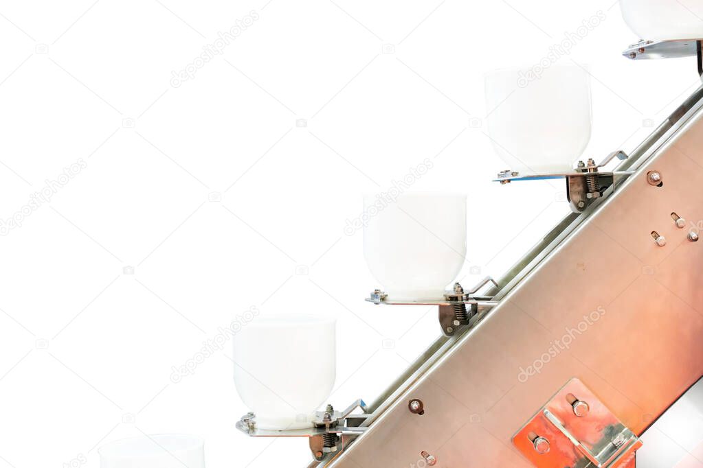 Close up modern buckets chain or bowl commercial conveyor (cup feeder) for food or material transport industrial isolated on white background with clipping path