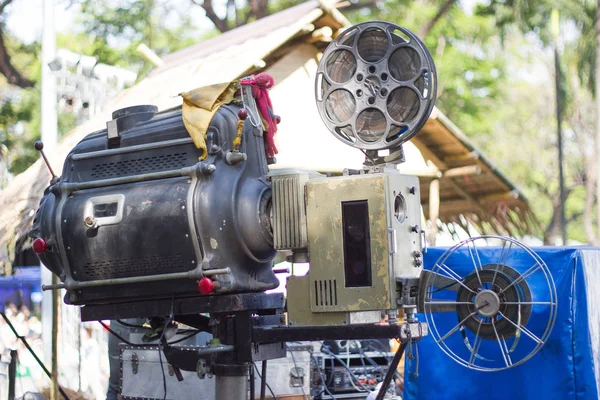 The old  analog rotary film movie projector at outdoor cinema movies theater for show people in the Park at Bangkok Thailand