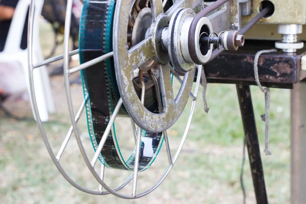 Close Up - The old  analog rotary film movie projector at outdoor cinema movies theater for show people in the Park at Bangkok Thailand