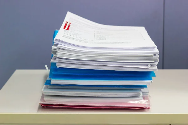 file folder and Stack of business report paper file on the table in a work office, concept document in work office