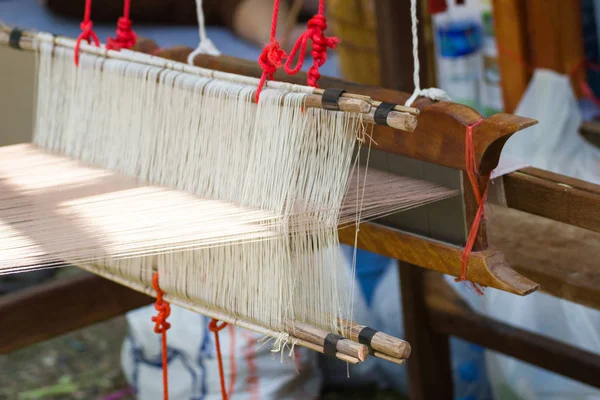 Household Loom weaving - Detail of weaving loom for homemade silk or textile production of Thailand