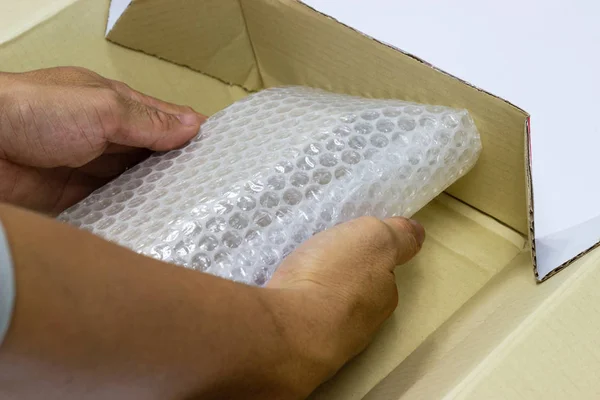 Hand Man Hold Bubble Wrap Packing Protection Product Cracked Insurance — Stock Photo, Image