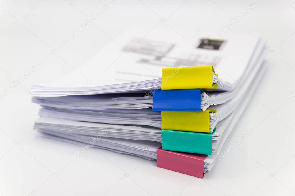 Stack of papers documents in archives files with paper clips on desk at offices, business concept.