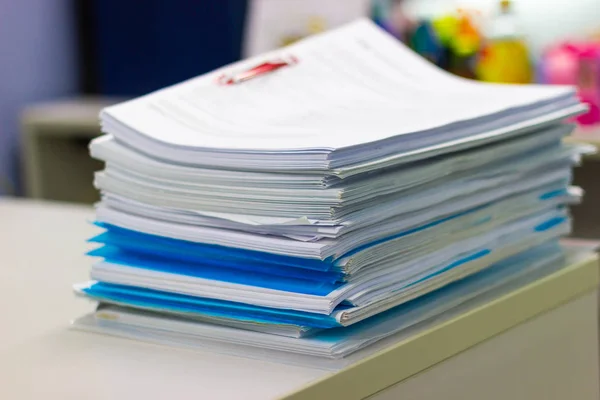 file folder and Stack of business report paper file on the table in a work office, concept document in work office