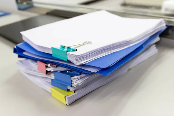 file folder and Stack of business report paper file on the table in a work office, concept document in work office