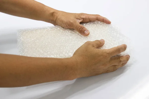 hand man hold bubble wrap, for Packing and protection product cracked or insurance During transit, concept packing and protection product cracked