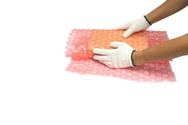 Man are using a bubble wrap wrapped Packing and protection brown box to prevent impact damage during transport isolated white background