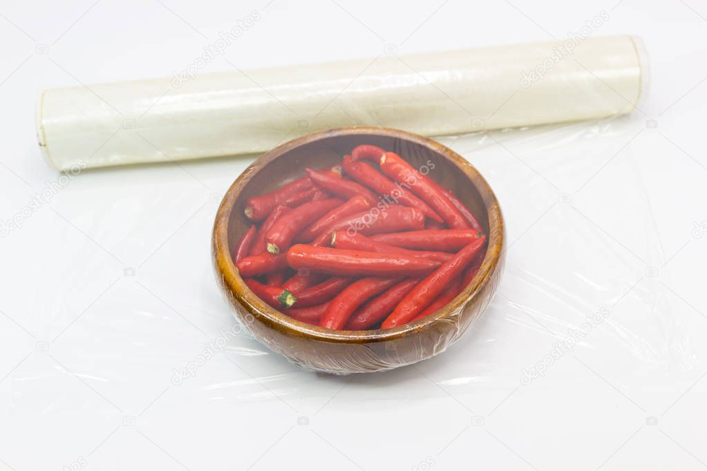 Fresh small tomato which are wrapped with plastic film preservation concept to maintain freshness.