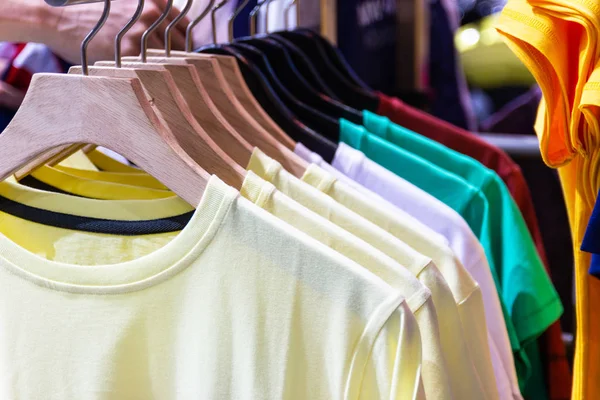 Colorful t-shirt on hangers for sale in department stores.