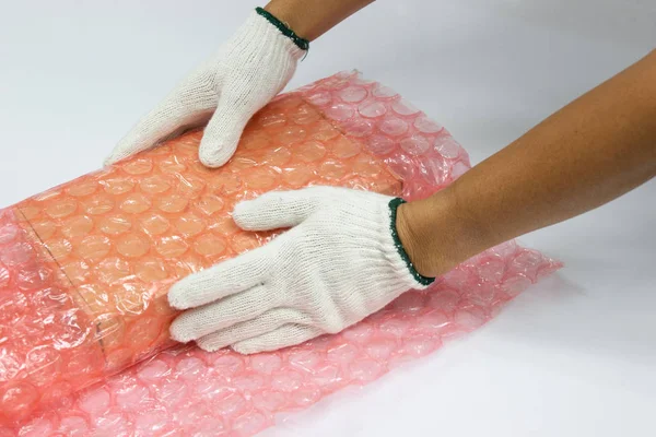 hand man hold bubble wrap, for Packing and protection product cracked or insurance During transit.