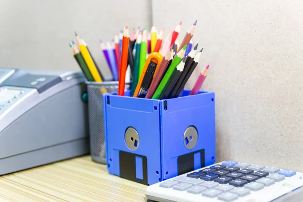 recycle floppy disk, Creative objects used for Store supplies such as pen pencils Scissors in a box on the table in work office, concept recycle floppy disk