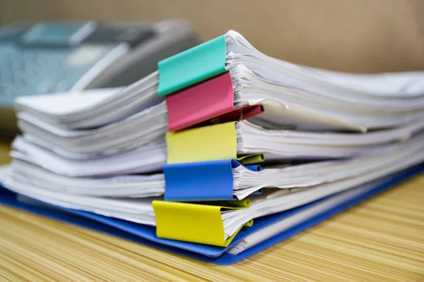 file folder and Stack of business report paper file on the table in a work office, concept document in work office