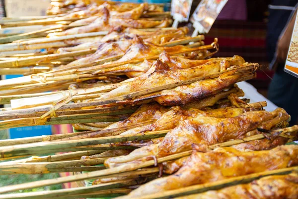 Thailand Street Food Thai Food Style Roasted Chicken in Charcoal Oven Bangkok Thailand chicken is often seasoned or coated in a spice rub, barbecue sauce