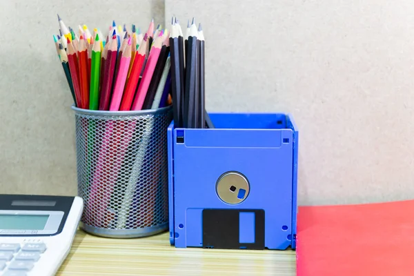 recycle floppy disk, Creative objects used for Store supplies such as pen pencils Scissors in a box on the table in work office, concept recycle floppy disk