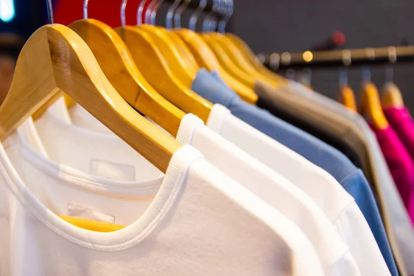 Colorful t-shirt on hangers for sale in department stores.