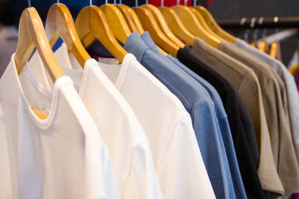 Colorful t-shirt on hangers for sale in department stores.