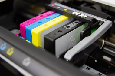 Close up color printer ink jet cartridge of the printer inject  clipart
