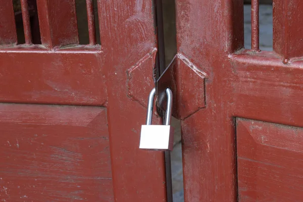 Close up padlock on the door for wooden door lock at home