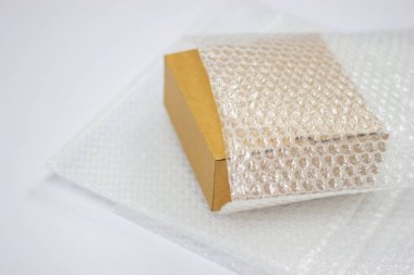 Bubbles covering the box by bubble wrap for protection product  clipart