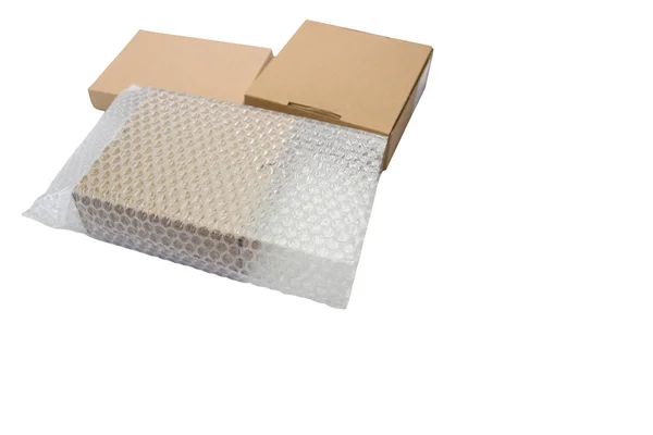 Bubbles covering the box by bubble wrap for protection product — Stock Photo, Image