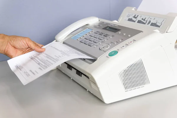 Hand man are using a fax machine in the office — Stock Photo, Image