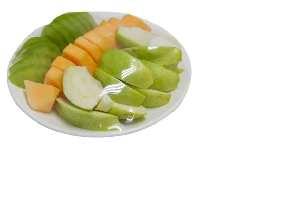 Fruits which are wrapped with plastic film preservation on a table — Stock Photo, Image