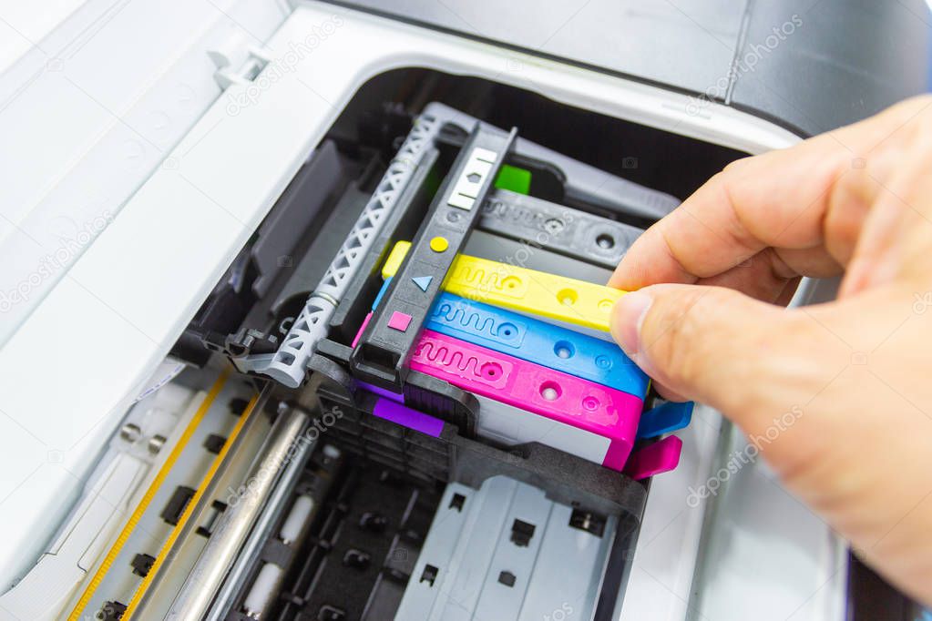 Technicians are install setup the ink cartridge or inkjet 
