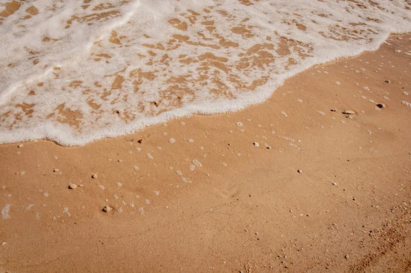 White waves of Azove sea on a red sand. — Stock Image White waves of Azove sea on a red sand. Stock Image