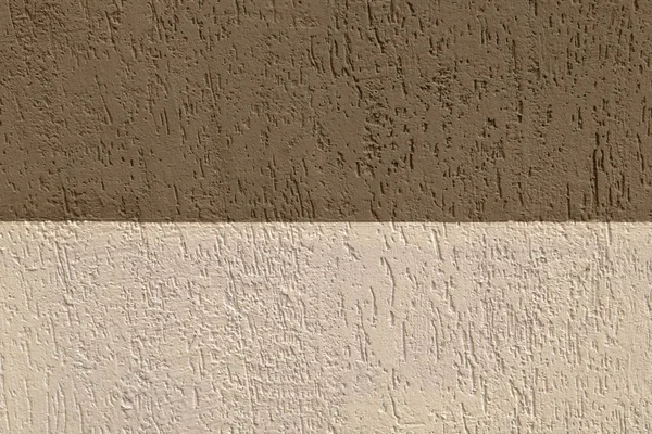 关闭墙石砖角落的户外景观 墙的半部分被太阳照亮 另一部分在阴影中 图案与米色棕色矩形元素 抽象图像 — 图库照片