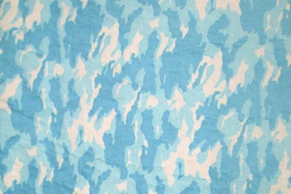 Een blauwe camouflage patroon als achtergrond . — Stockfoto