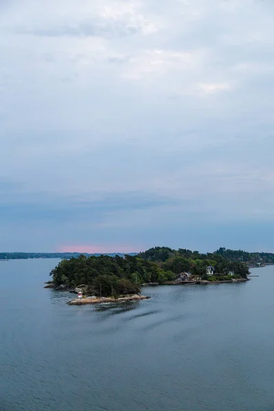 Houses and cottages in quiet Stockholm Archipelago with colorful trees, Stockholm Sweden