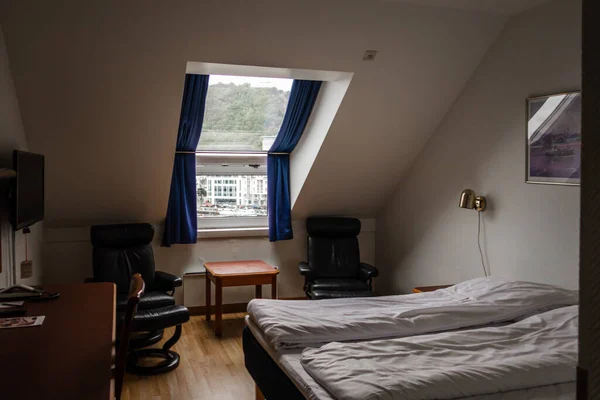View of a older hotel room with two beds, Alesund Norway