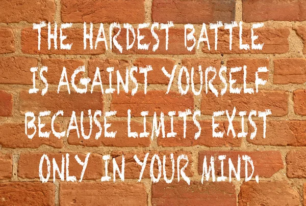 positive quote about strength on red brick wall background