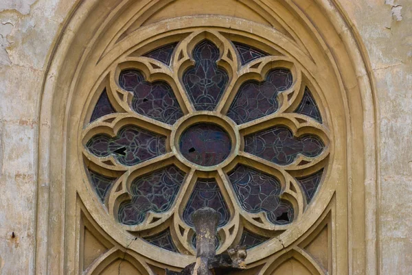 Gothic octagonal rose, architectural element of the facade of the ancient building