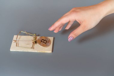 Money bitcoin in a mousetrap clipart