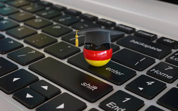 ドイツ語を学ぶオンライン3Dコンセプト ノートパソコンのキーボードの3Dレンダリングで卒業キャップとドイツのフラグ — ストック写真