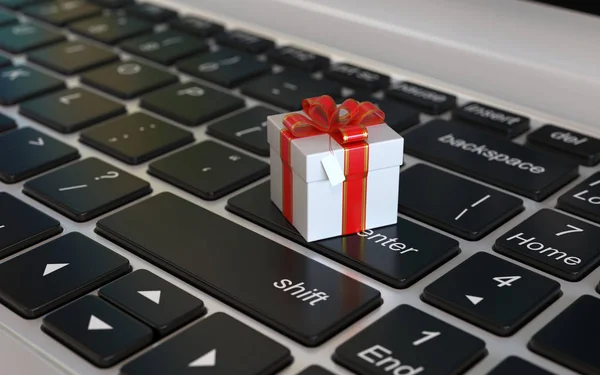 Gift box 3d icon on laptop keyboard, 3d rendering