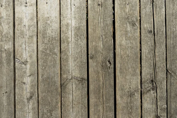 Gri ahşap tahta duvar. Eski bir duvara sabitlenmiş panoları.