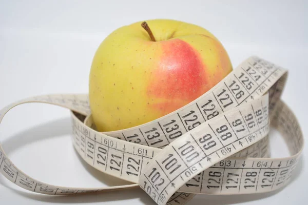 apple fruit with meter to  measure lenght diet food