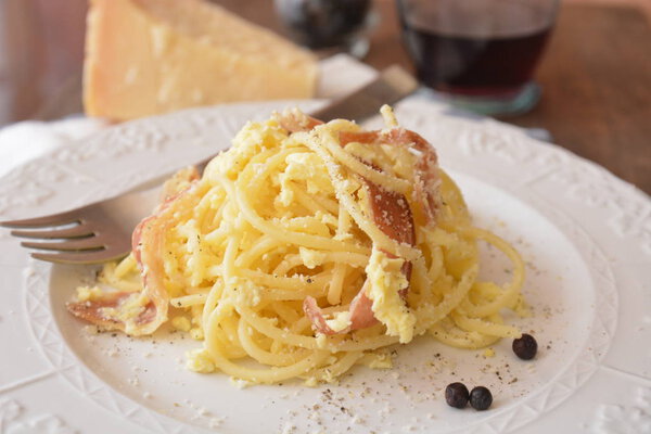 italian spaghetti carbonara tipic food with eggs cheese pepper