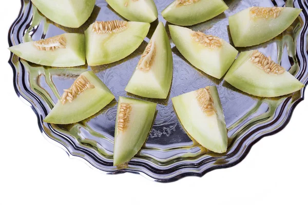 Sarı kavun veya ayrıntılı olarak eski tepsisindeki kavun taze dilim