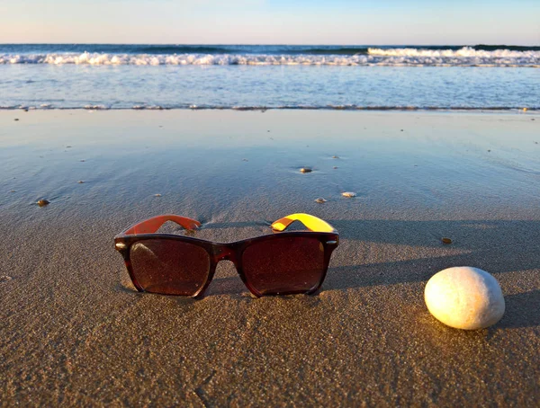 Sunglasses Slippers Shoes Beach Stones — Stock Photo, Image