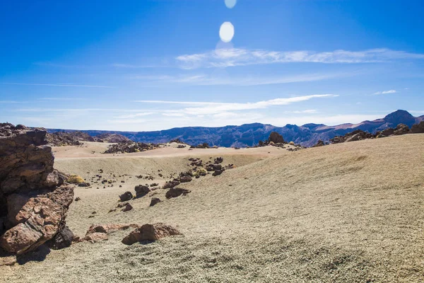 volcanic rocks of the volcano. desert with stones mountains and blue sky