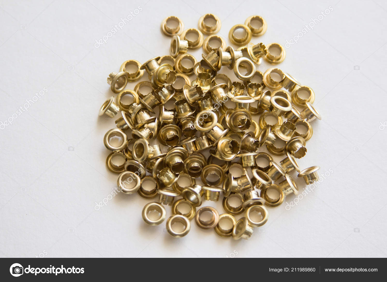Small Gold Metal Eyelets Stock Photo Irinak81 211989860 Small Gold Metal Eyelets Stock Photo